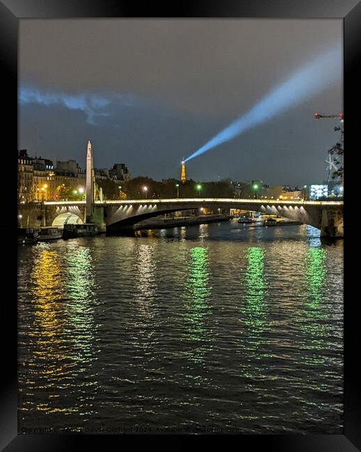 Evening Eiffel tower spotlight  Framed Print by Robert Galvin-Oliphant