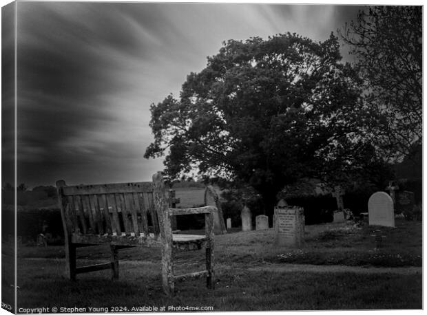 Bench in Graveyard Canvas Print by Stephen Young