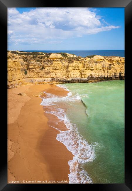 Vertical view of cliffs and ocean waves crashing onto beach near Framed Print by Laurent Renault