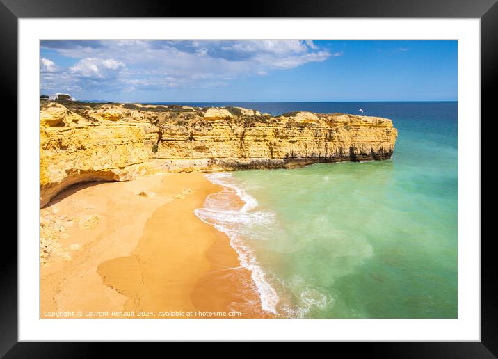 View over cliffs and ocean waves crashing onto beach near Albufe Framed Mounted Print by Laurent Renault