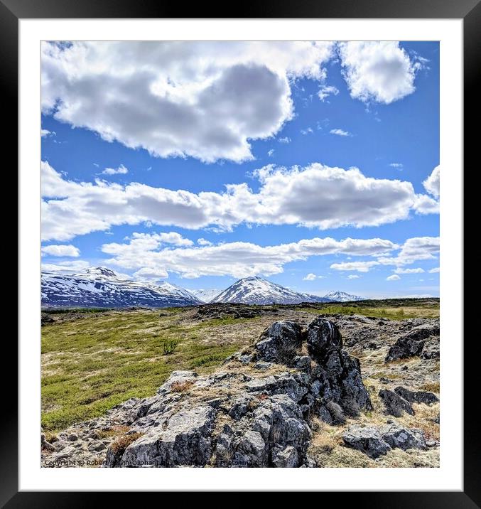 A rocky landscape with clouds and snowy mountains Framed Mounted Print by Robert Galvin-Oliphant