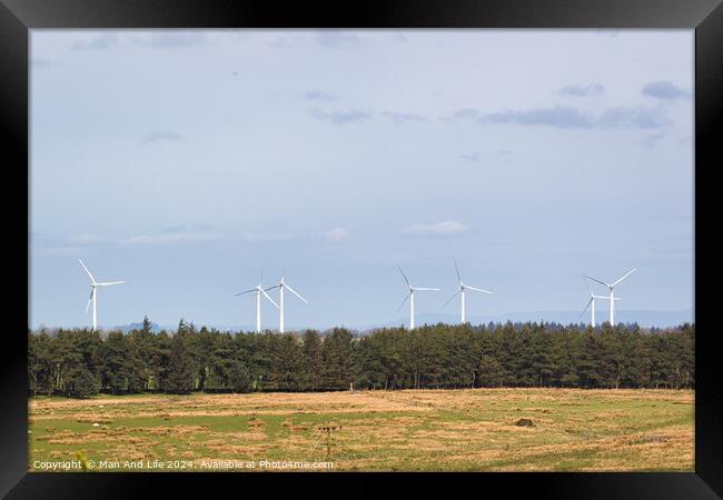 Wind Turbines in Countryside Framed Print by Man And Life