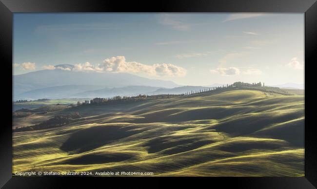 Landscape in Tuscany with farmhouse and rolling hills Framed Print by Stefano Orazzini