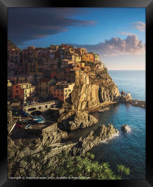Manarola village, rocks and sea. Cinque Terre, Italy. Framed Print by Stefano Orazzini