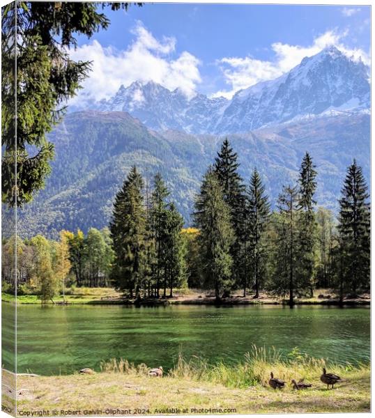 Alpine peaks and lake Canvas Print by Robert Galvin-Oliphant