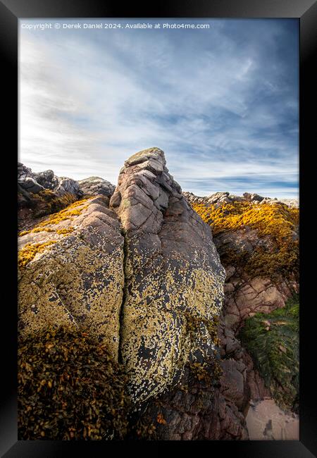 Colourful Rocks on the beach at Firemore Sands Framed Print by Derek Daniel