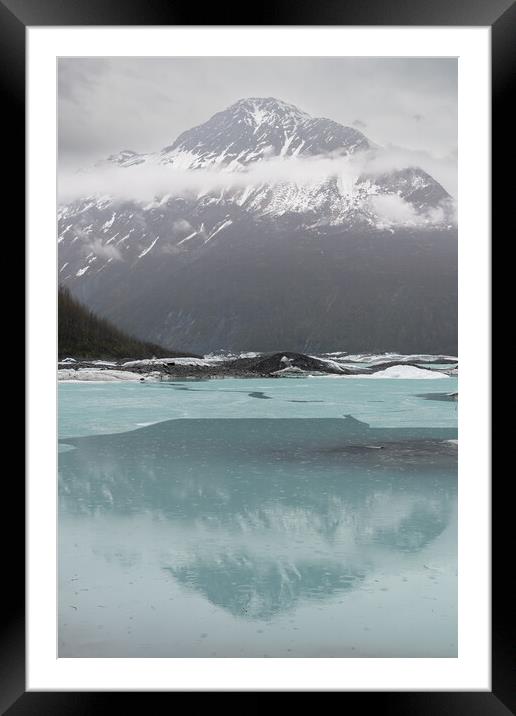 Mist and Snow covered mountains reflected between the ice sheets in Valdez Glacier Lake in the rain, Valdez, Alaska, USA Framed Mounted Print by Dave Collins