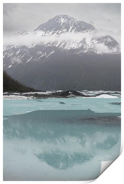 Mist and Snow covered mountains reflected between the ice sheets in Valdez Glacier Lake in the rain, Valdez, Alaska, USA Print by Dave Collins