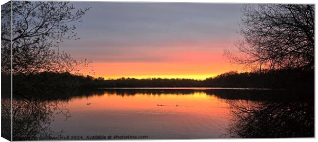 Sunrise lake reflection Canvas Print by Oliver Hull
