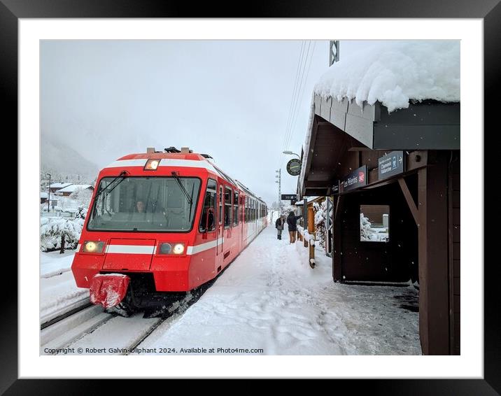 Red train at snowy station Framed Mounted Print by Robert Galvin-Oliphant