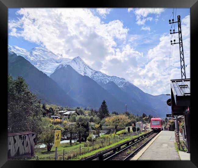 Train approaching alpine station Framed Print by Robert Galvin-Oliphant