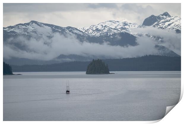 Commercial fishing boat  in Frederick Sound near Petersburg with clouds around the mountains beyond, Alaska, USA Print by Dave Collins