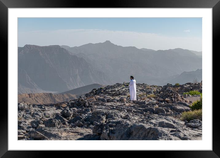 Man in traditional Oman dishdasha in the Harim desert in Musandam, Musandam, Oman Framed Mounted Print by Dave Collins
