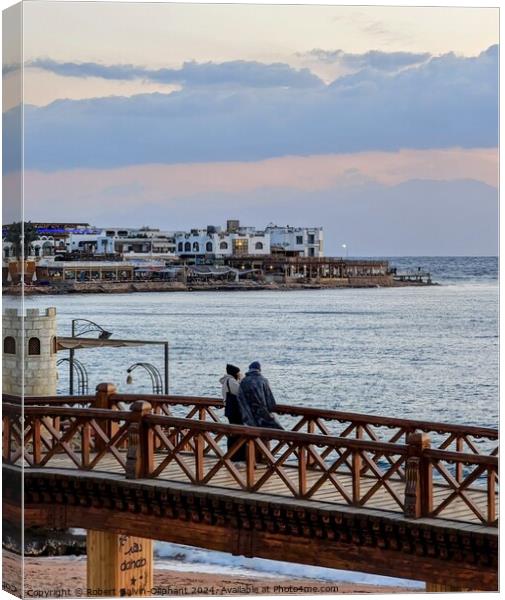 A couple on bridge looking out to sea Canvas Print by Robert Galvin-Oliphant