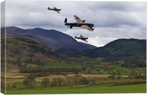 Lancaster bomber and wingmen. Canvas Print by Kevin Tate
