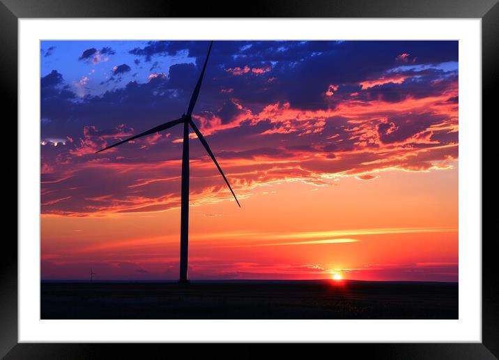 A silhouette of a wind turbine against a vibrant sunset backdrop Framed Mounted Print by Michael Piepgras