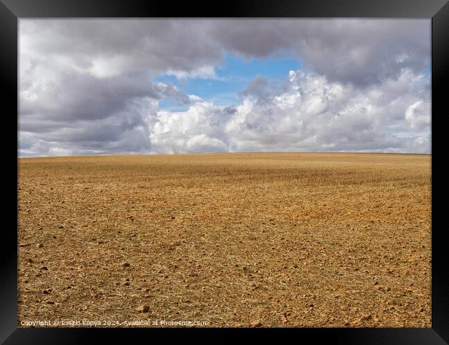 Patch of blue sky - Calzadilla de los Hermanillos Framed Print by Laszlo Konya