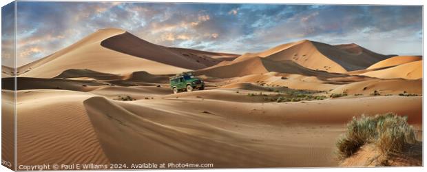 Defender Crossing the Erg Chebbi Sand Dunes, Sahara, Morocco. Canvas Print by Paul E Williams
