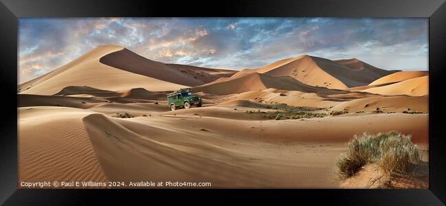 Defender Crossing the Erg Chebbi Sand Dunes, Sahara, Morocco. Framed Print by Paul E Williams