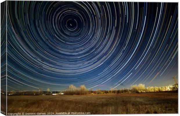 Star Trails Over Field Canvas Print by Dominic Gareau
