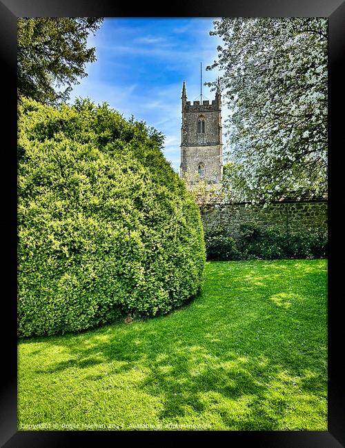 Spring blossom and Norman church Framed Print by Roger Mechan