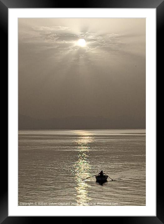 Sun shining on a lone rowboat  Framed Mounted Print by Robert Galvin-Oliphant