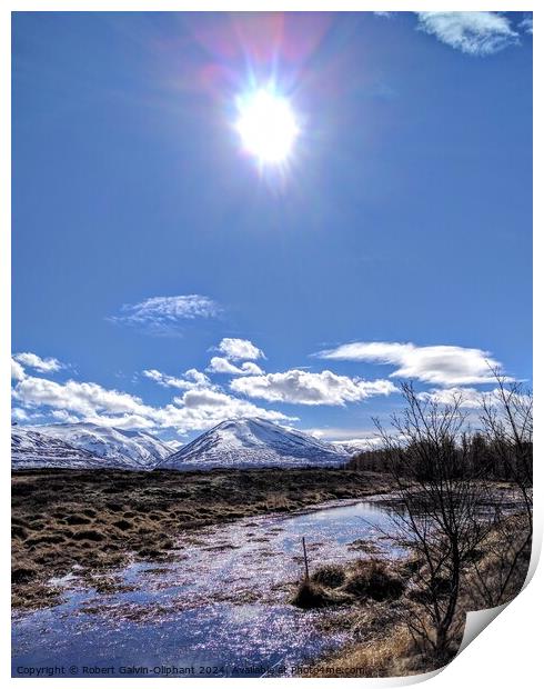 Sun shining on an icy pond and snowy mountains  Print by Robert Galvin-Oliphant
