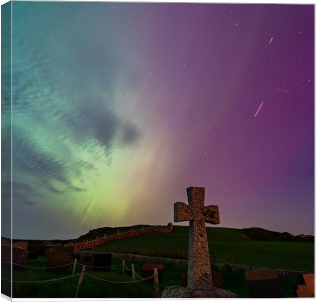 The Northern Lights in a graveyard on Anglesey Wales Canvas Print by Gail Johnson