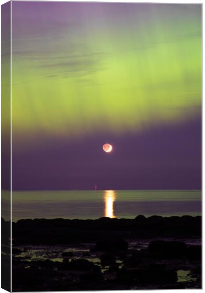 The Northern lights over the moon in Hunstanton Canvas Print by Bryn Ditheridge