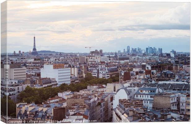Paris cityscape with Eiffel Tower and defense district at sunset Canvas Print by Laurent Renault