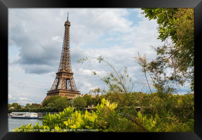 Eiffel Tower viewed from the banks with frame of vegetation Framed Print by Laurent Renault