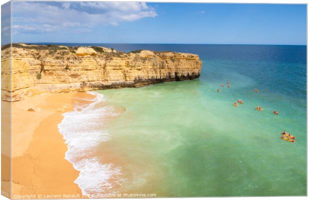 View of cliffs and canoes on ocean, beach near Albufeira, Portug Canvas Print by Laurent Renault