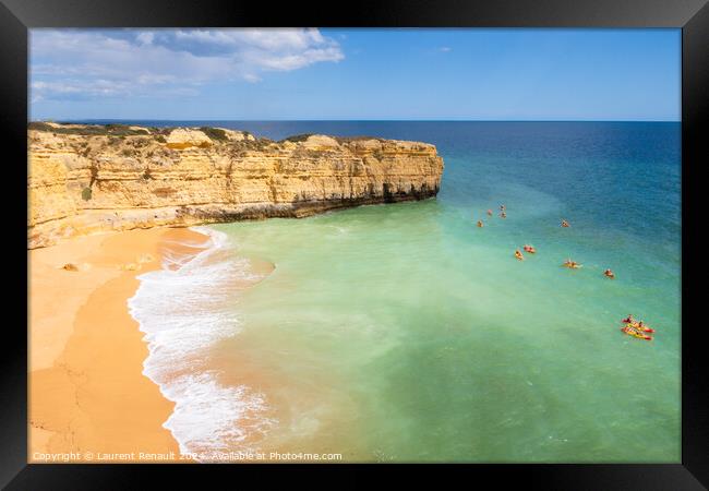 View of cliffs and canoes on ocean, beach near Albufeira, Portug Framed Print by Laurent Renault