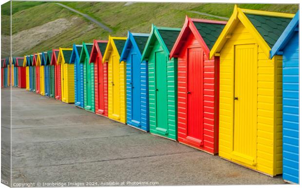 Multicoloured beach huts Canvas Print by Ironbridge Images
