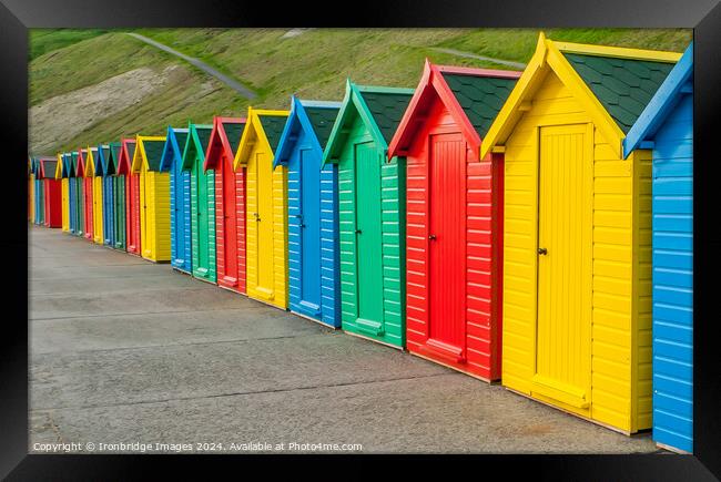 Multicoloured beach huts Framed Print by Ironbridge Images