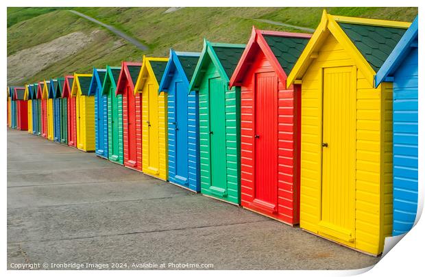 Multicoloured beach huts Print by Ironbridge Images