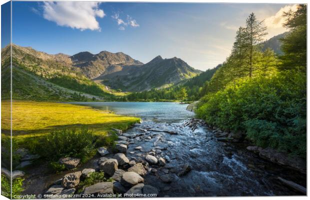 Trees and rocks along the shores of Lake Arpy. Aosta Valley Canvas Print by Stefano Orazzini