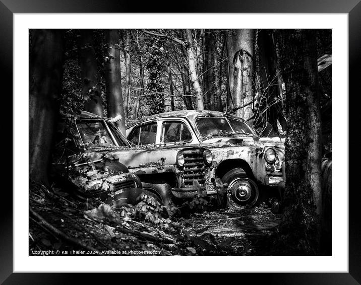 Old rusted car in the woods Framed Mounted Print by Kai Thieler