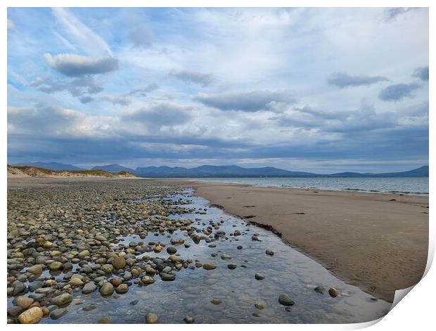 Rocky Welsh Traeth Llanddwyn Beach with view of Snowdonia Print by Barbora Sebestova