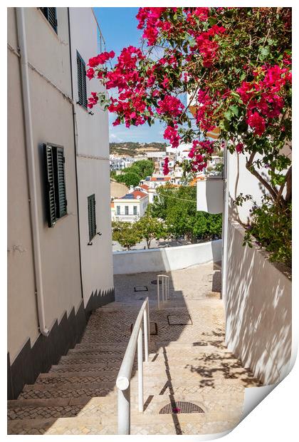 Steep street with Bougainvillea flowers, Albufeira, Portugal Print by Kevin Hellon