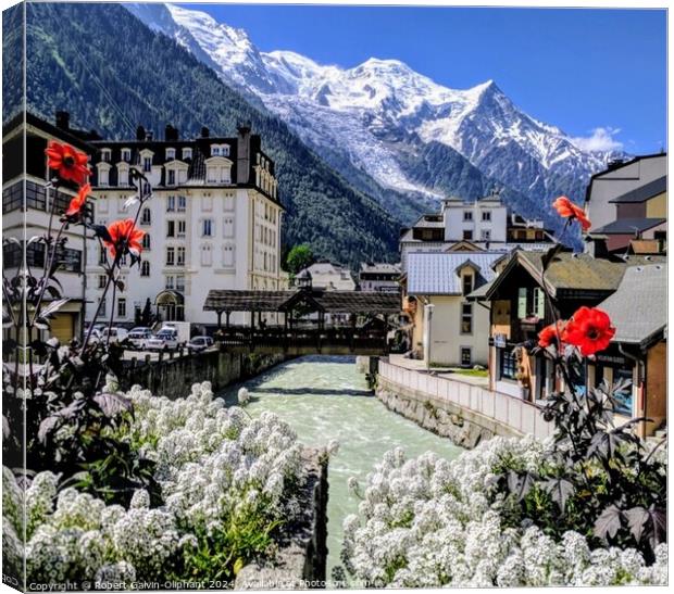 Flowers, river, and snowy Alps Canvas Print by Robert Galvin-Oliphant