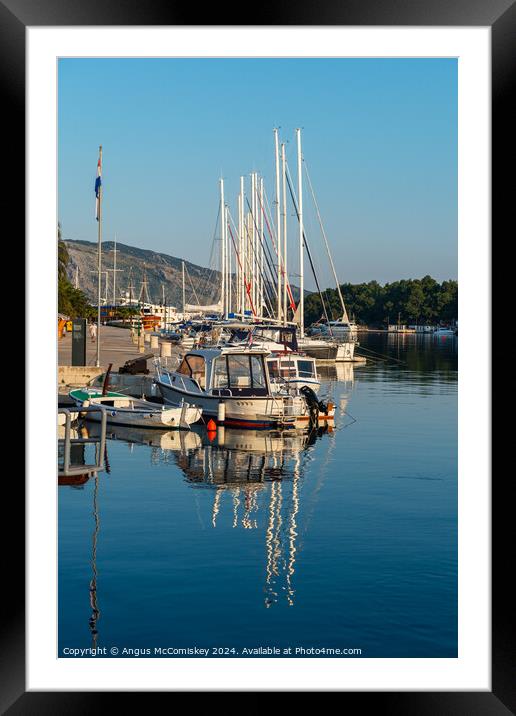 Boats moored in Stari Grad harbour, Croatia Framed Mounted Print by Angus McComiskey