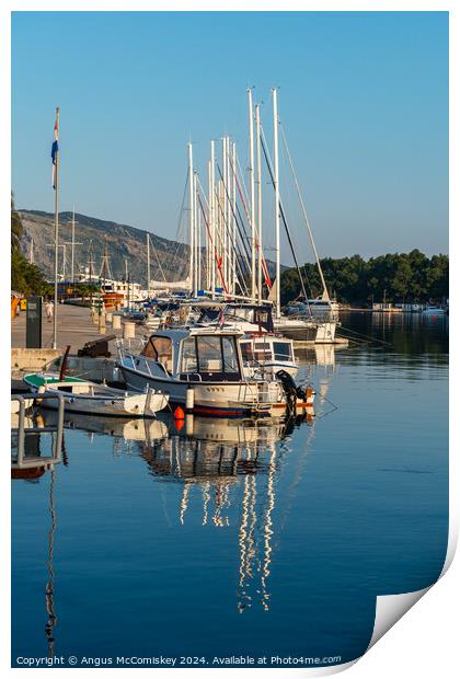 Boats moored in Stari Grad harbour, Croatia Print by Angus McComiskey
