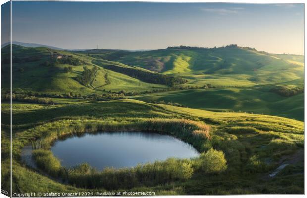 Small lake in the hills of the Crete Senesi at sunset. Tuscany,  Canvas Print by Stefano Orazzini