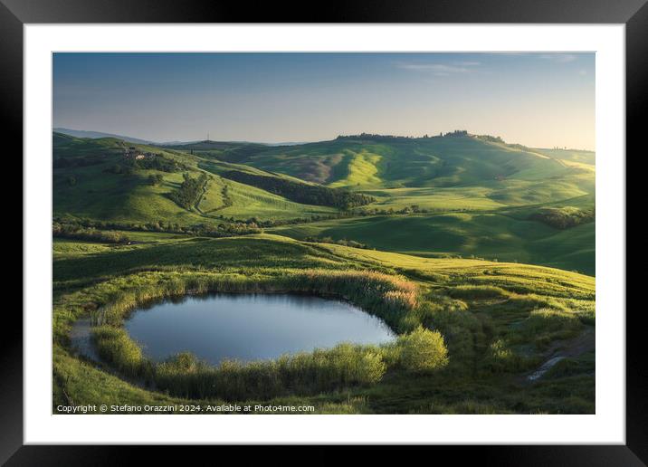 Small lake in the hills of the Crete Senesi at sunset. Tuscany,  Framed Mounted Print by Stefano Orazzini