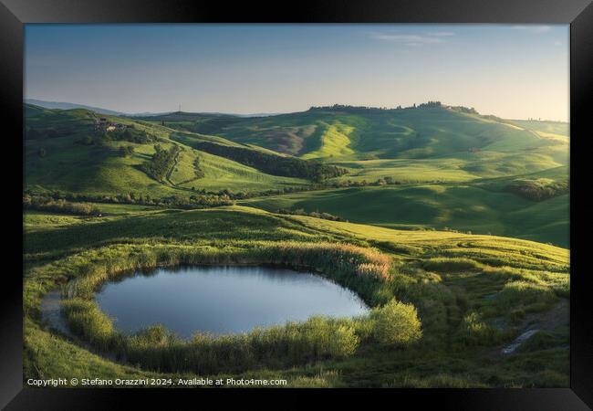 Small lake in the hills of the Crete Senesi at sunset. Tuscany,  Framed Print by Stefano Orazzini