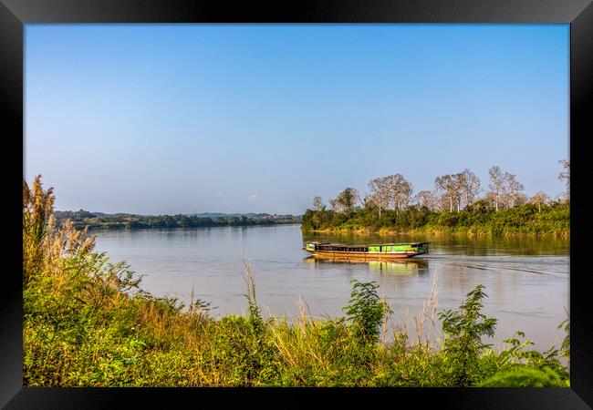 Wooden Boat on Mekong River Framed Print by Kevin Hellon