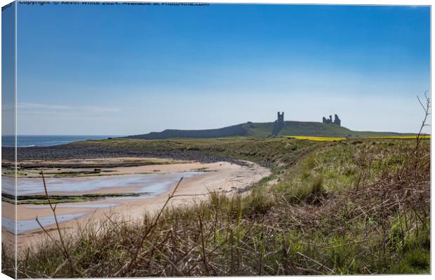 Dunstanburgh castle in the mist Canvas Print by Kevin White