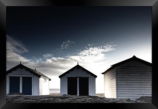 Southwold beach huts in winter Framed Print by Simon Wrigglesworth