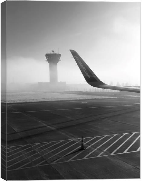 Foggy airport runway in b&w Canvas Print by Camilo Diaz